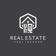 initial monogram logo for real estate with building shape creative design	
