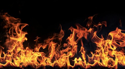 Fototapeta premium Fire flames on black background