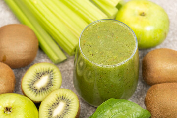 Green smoothie with kiwi, apples, celery, spinach, a healthy natural foods dish