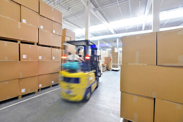 forklift driver in a warehouse for industrial goods