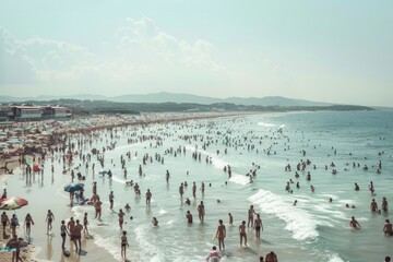 Fototapeta premium Crowded Summer Beach Day with Happy Vacationers Enjoying the Sun and Sea