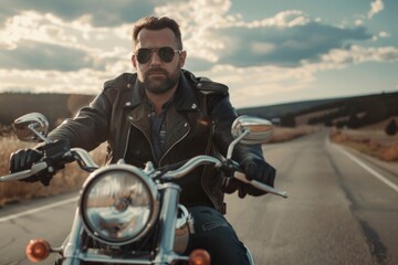 Rugged Biker Cruising Down the Highway at Sunset on Classic Motorcycle
