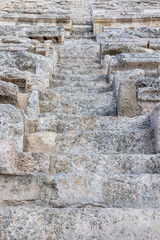 Detail of the stone steps in the ancient theater. Amman. Jordan. Vertically. 
