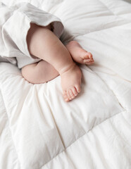 newborn baby sleeping on the withe soft quilt, postcard white space