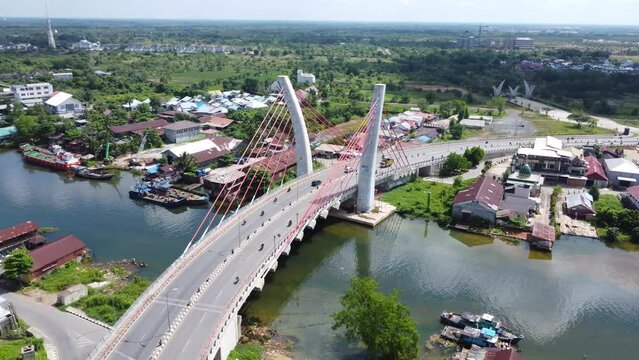 Aerial view of the Sei Alalak Bridge located in Banjarmasin which is known as the first arched bridge in Indonesia