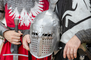 Elements of medieval iron knight armor for battle, helmet, spaulders, pouldrons, vambraces,...