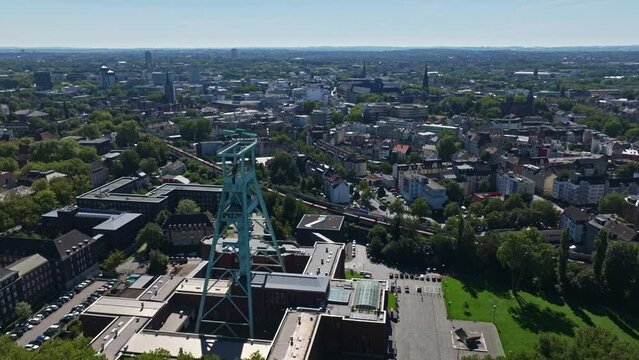 Aerial drone view capturing a train crossing near Mining Museum in Bochum , Germany . 01 July 2023