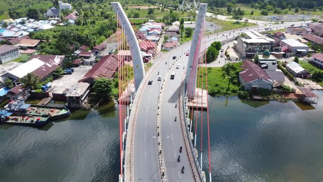 Aerial view of the Sei Alalak Bridge located in Banjarmasin which is known as the first arched bridge in Indonesia