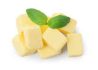Pile of tasty butter cubes and basil leaves isolated on white, top view