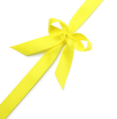 Yellow ribbon with bow on white background, top view