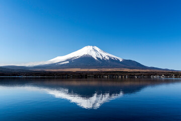 Mt. Fuji with reflection at Yamanaka lake, Yamanashi, Japan
