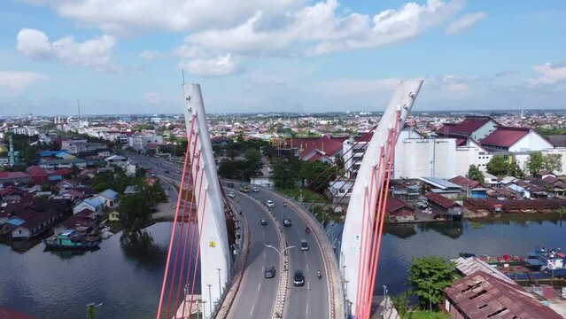 Aerial view of the Sei Alalak Bridge located in Banjarmasin which is known as the first arched bridge in Indonesia