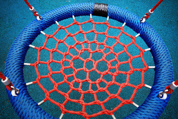 Red netting on children playground object backdrop