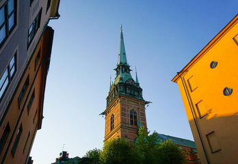 Low angle view of a church tower against the sky - Powered by Adobe