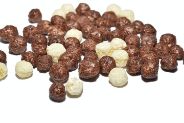 Corn balls, for a delicious breakfast, lie on a white background.