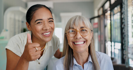 Women, doctor and patient with thumbs up on portrait for glasses, prescriptions and happy with choice. Optometrist, smile and confident at shop with support, trust and care for eyesight or eye care
