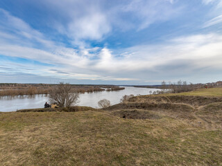 early spring flood, high water in the countryside, river overflowing its banks, trees in the water, flooded banks, environmental pollution, ecology