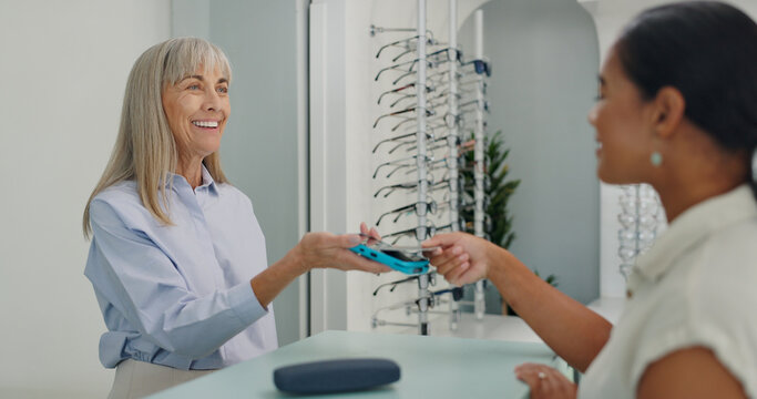 Shopping, credit card and people with contactless payment for retail service and eye care at store. Tap, machine and optometrist with customer with bank purchase transaction at optical shop.