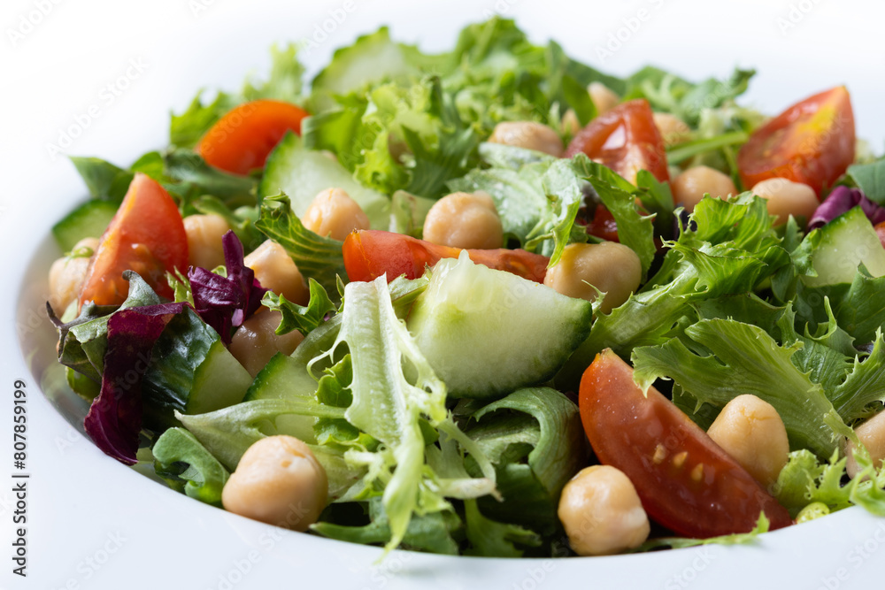 Poster Healthy chickpea salad with tomato,lettuce and cucumber isolated on white background