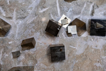 Close-up of clasters of pyrite and quartz crystals background. Texture of crystals of pyrite. Raw specimen of pyrite crystal stone. Selective focus