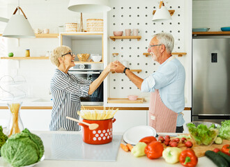 love kitchen senior woman man couple home retirement happy food smiling husband wife together dancing