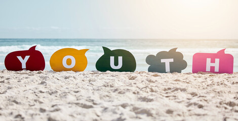 Obraz premium Speech bubbles, beach and sand with summer, spelling and word on the seashore with communication. Empty, color and letters with voice, lens flare and sunshine with opportunity, seaside and opinion