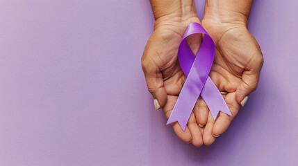 on world lupus day and world cancer day adult hands holding purple ribbon on purple background