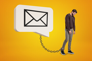 Man chained to his email notifications concept