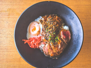 Beef Tenderloin Rice Bowl with onsen half boiled egg and pickled ginger