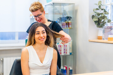 Woman in a hair salon during repairing hair treatment