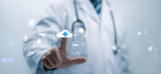 A medical worker touch technology cloud computing medical cross shape and Big Data Healthcare concept.Information technology computing medicine integration. Medical database, cloud server