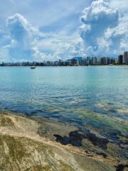 Inspire tropical beach seascape horizon. Buildings by the sea in Guarapari Espirito Santo Brazil