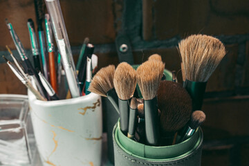 Makeup kit brushes in salon beauty .Makeup Brushes Fluffy Clean, Stand In Beauty Salon. Concept...