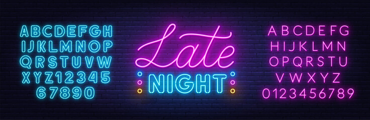 Late Night Neon Sign on brick wall background.