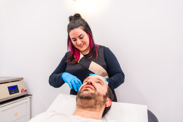 Man receiving a plasma injection as a treatment for baldness