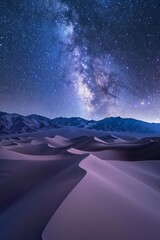 A sweeping panorama of rolling sand dunes under a starry night sky, the Milky Way visible