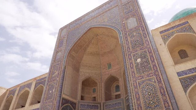 View of Kalan Minaret Emir and Alim Khan madrasah of Po-i-Kalan (Poi Kalan) - islamic religious complex Bukhara, Uzbekistan