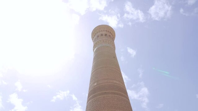 View of Kalan Minaret Emir and Alim Khan madrasah of Po-i-Kalan (Poi Kalan) - islamic religious complex Bukhara, Uzbekistan
