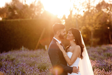 Wedding, sunset and couple in forest with love, celebration and commitment with gratitude and hope....
