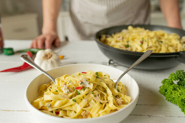 Healthy pasta dish aglio e olio for summer season with turkey or chicken meat, garlic, chili...