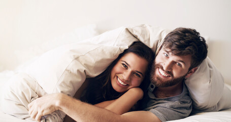 Happy, bed and couple portrait at morning with hug at home with love, marriage and cuddling...