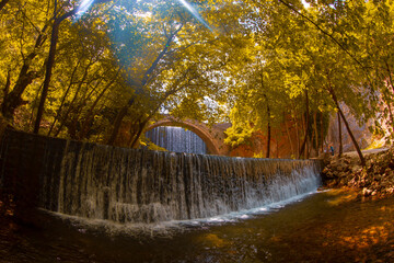 The old stone, arched bridge, between two waterfalls in Palaiokaria, Trikala prefecture, Thessaly,...