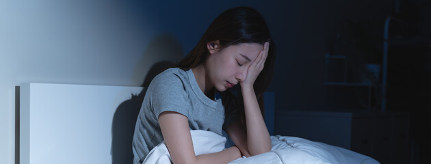 Anxiety disorder on insomnia woman concept, sleepless Woman open eye awakening on the bed at night...