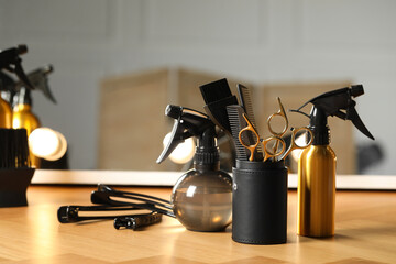 Set of hairdresser tools on table in salon