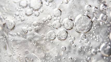 Crystal clear bubbles floating in clear liquid: a close-up view that captures the delicate and ethereal nature of water bubbles