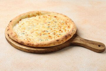 Delicious cheese pizza on beige textured table
