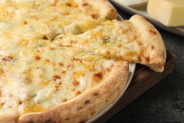 Delicious cheese pizza on dark grey table, closeup