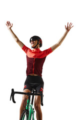 Winner. Young happy man in sportswear, helmet and goggles, sitting on bicycle against transparent...