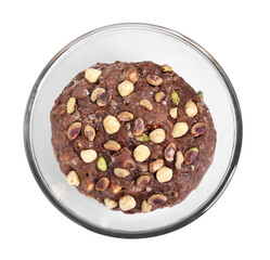 Raw chocolate dough with nuts in bowl isolated on white, top view