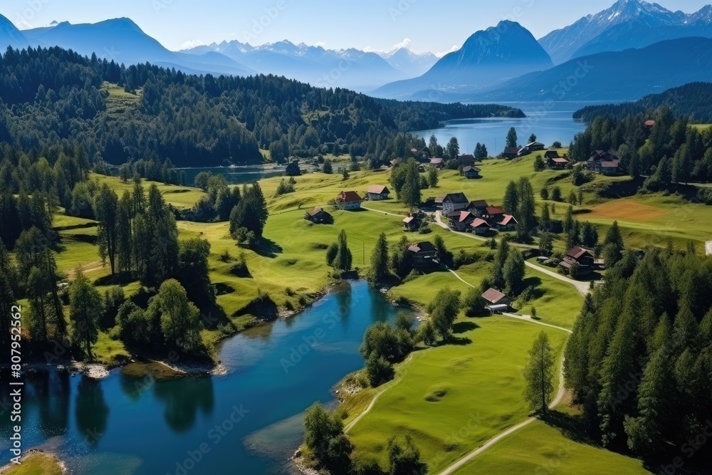 Wall mural slovenia landscape. stunning aerial view of idyllic lakeside village with alpine background.